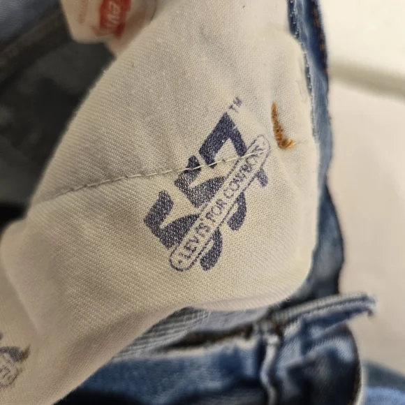 Vintage Levi's 557 Cowboy Distressed Jeans